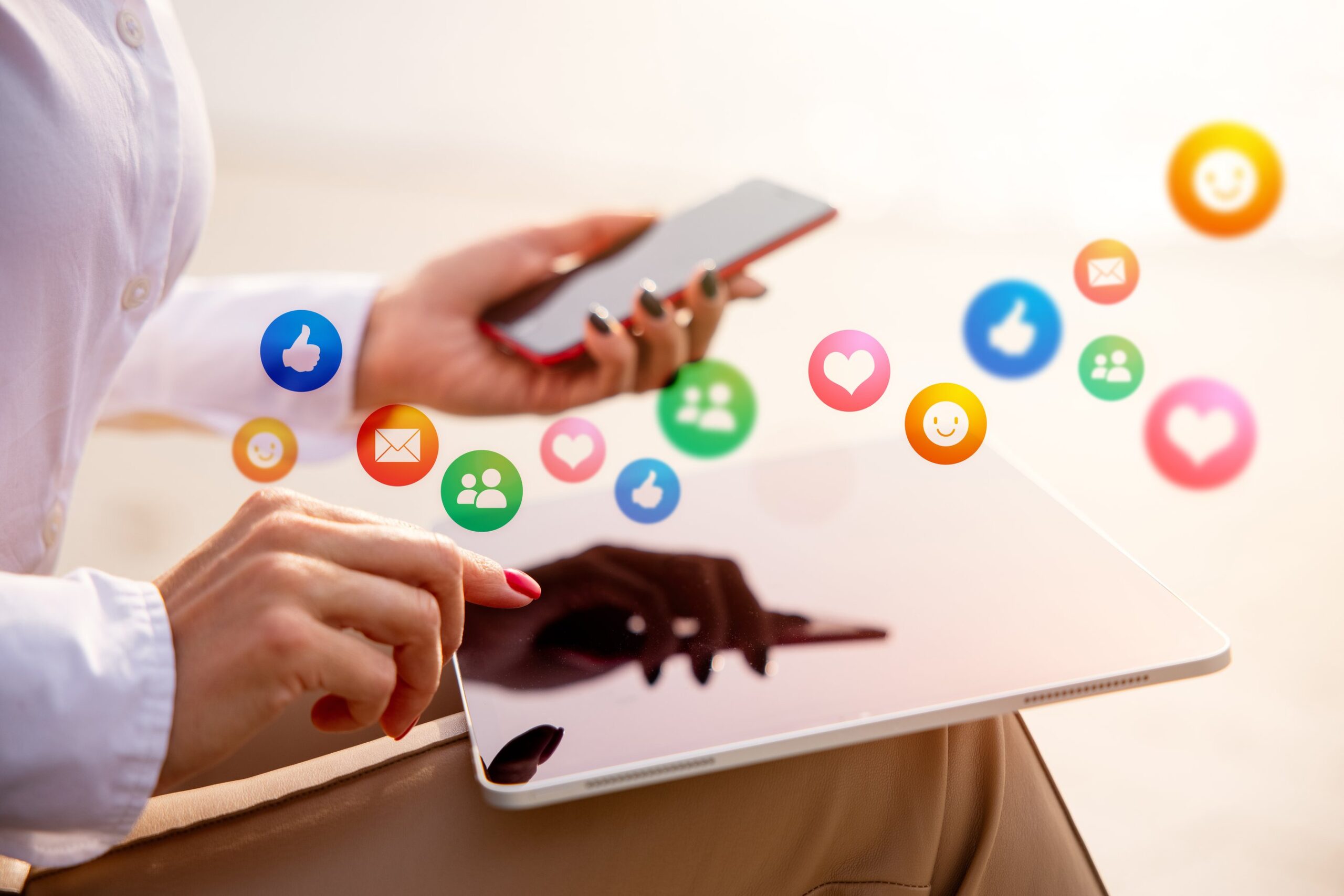 Person looking at their phone and tablet