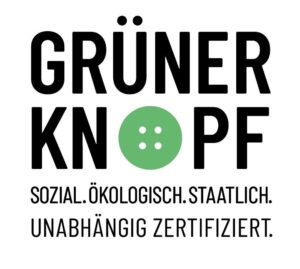 Das Logo des Umweltlabels "Grüner Knopf" mit einem grünen Knopfsymbol im Wort.