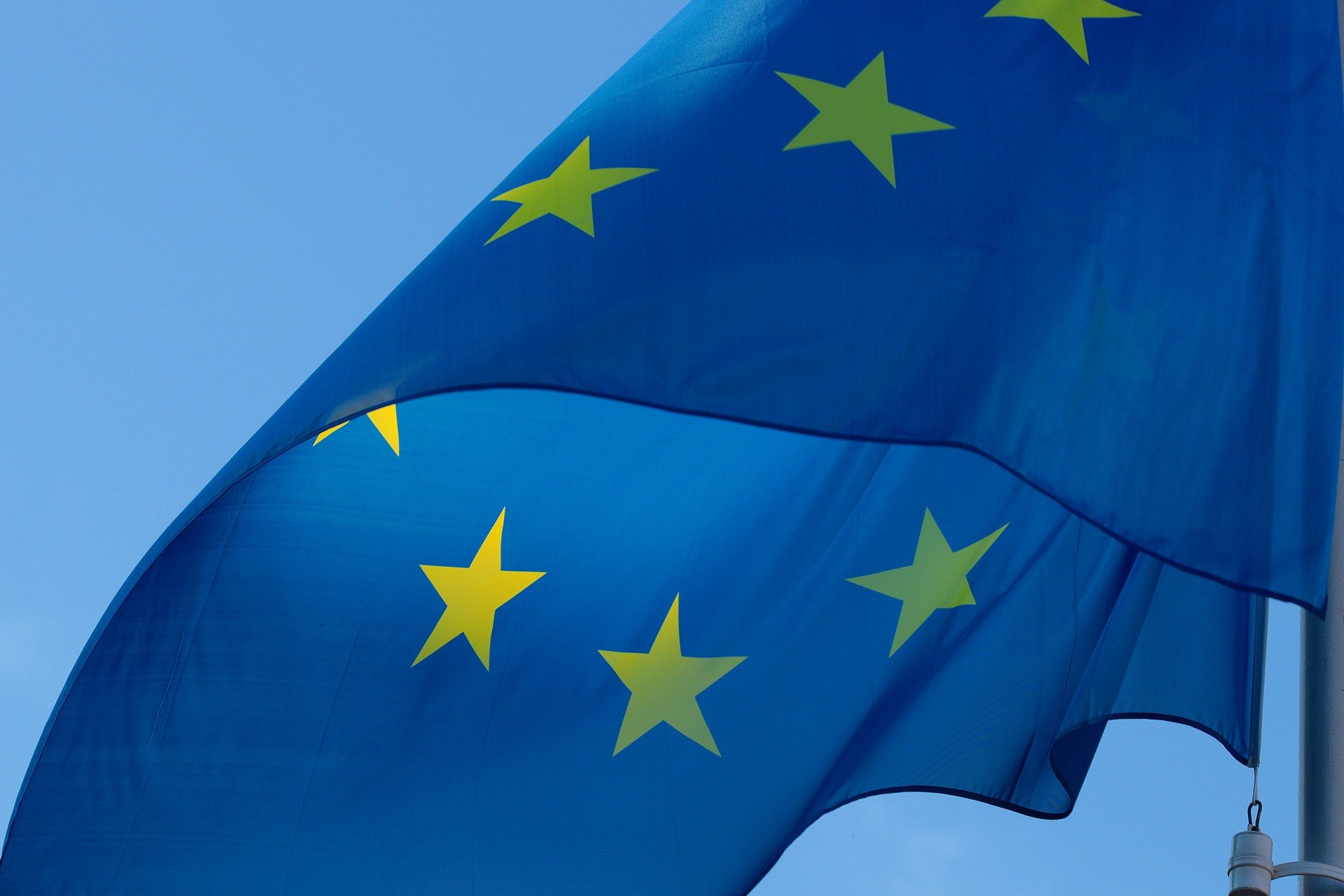 An EU flag fluttering in the wind.